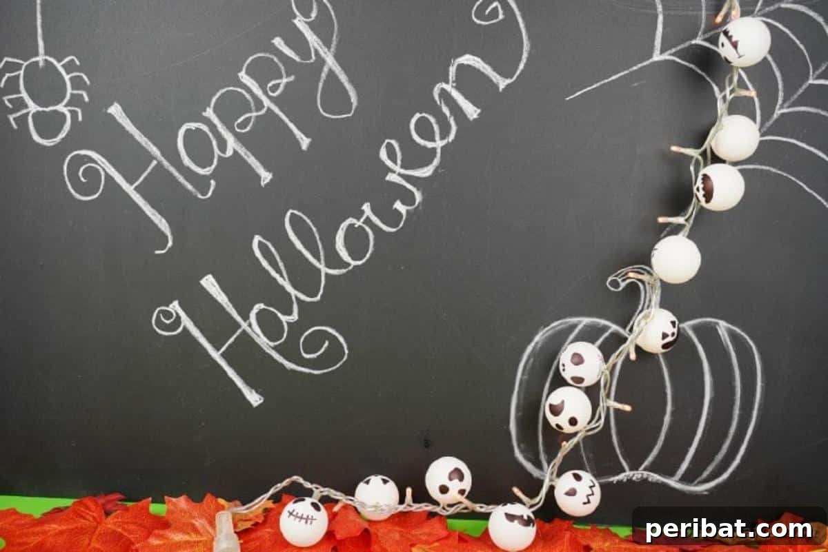 DIY Jack Skellington Halloween Garland with Ping Pong Balls 6 Jack Skellington light garland against chalkboard