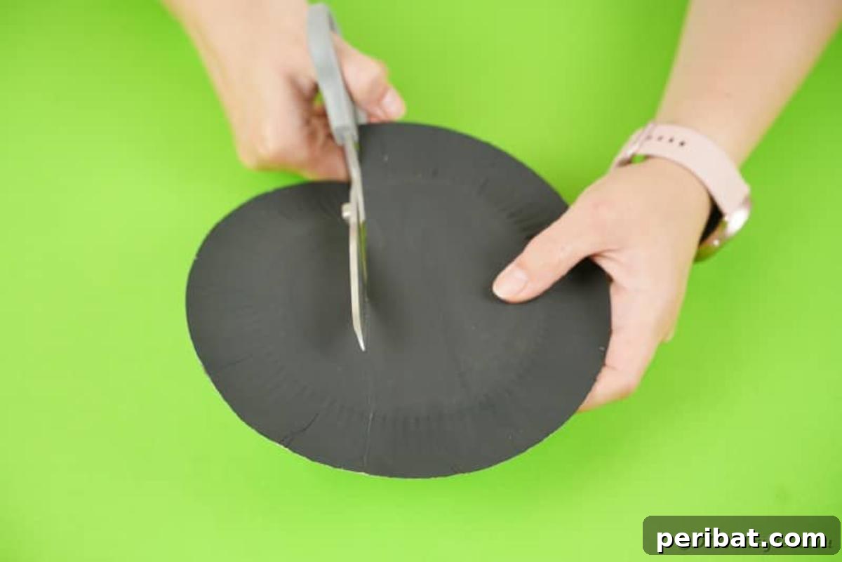 DIY Paper Plate Bat Candy Catchall 11 Cutting paper plates
