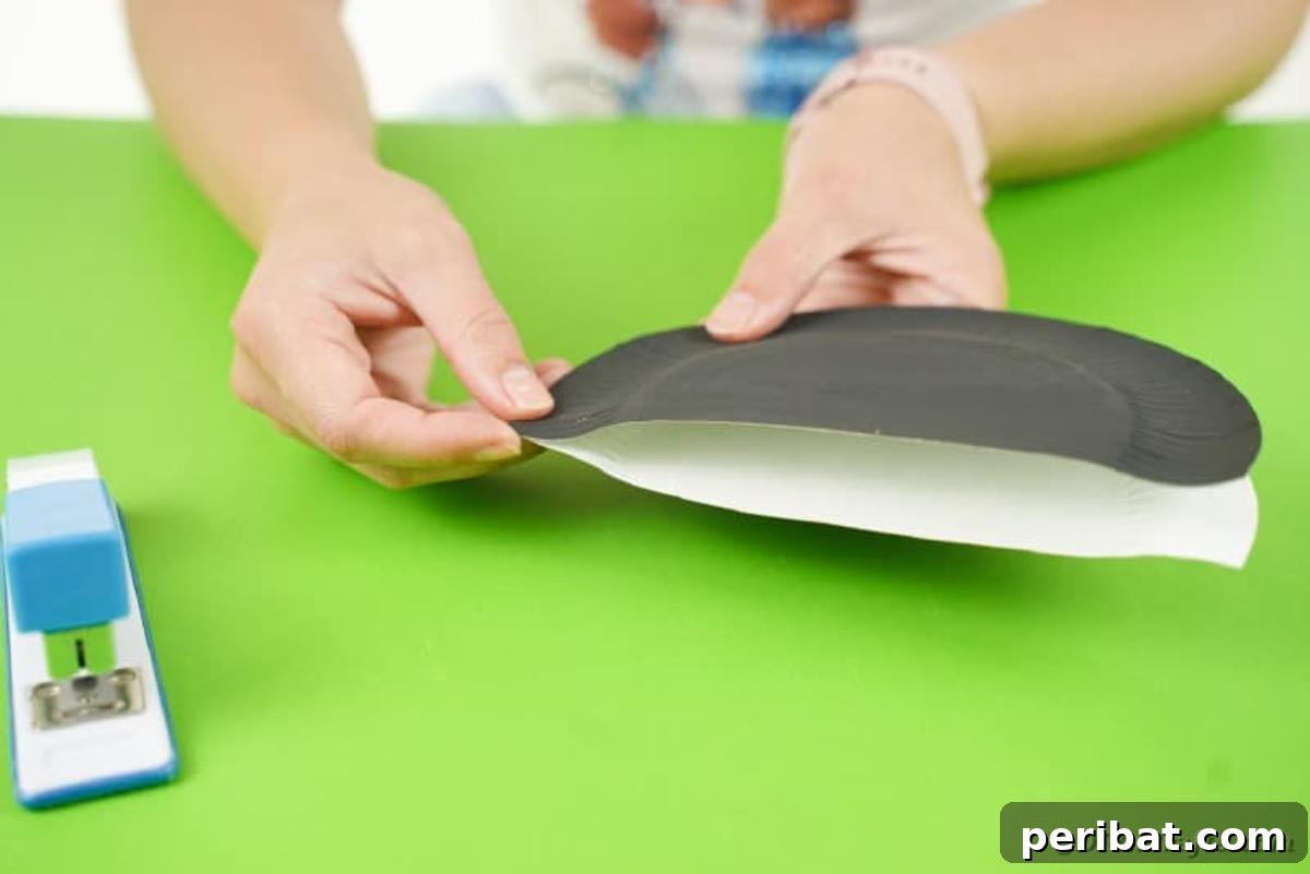 DIY Paper Plate Bat Candy Catchall 12 Stapling black plates together