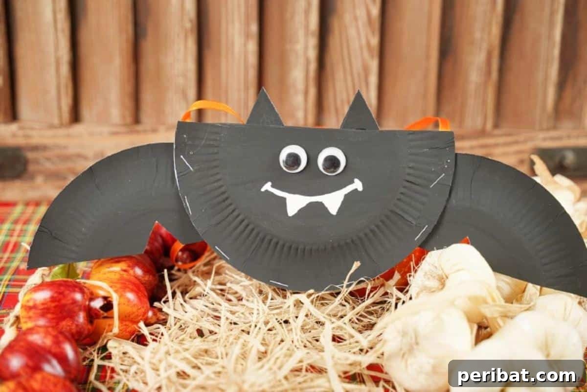 DIY Paper Plate Bat Candy Catchall 4 Paper plate bat sitting on hay