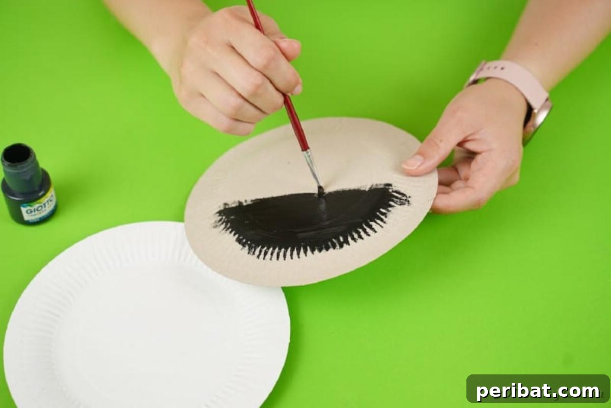 DIY Paper Plate Bat Candy Catchall 9 Painting a plate black