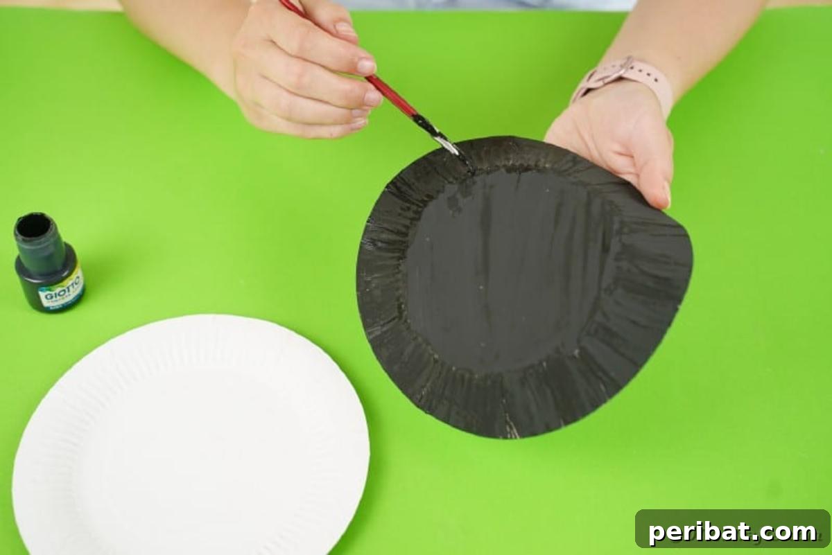 DIY Paper Plate Bat Candy Catchall 10 Painting a plate black
