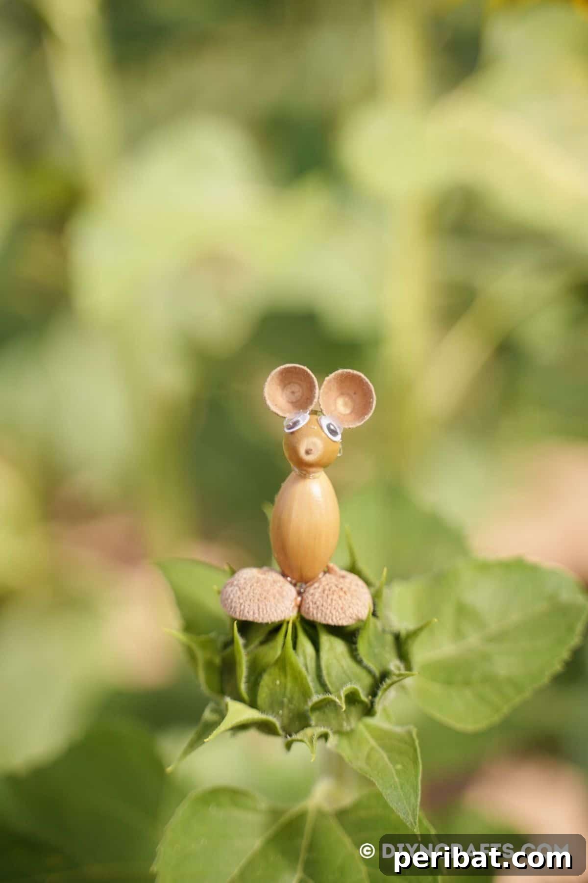 Craft Adorable Acorn Mice for Autumn Decor 4 Acorn mouse sitting on green bud
