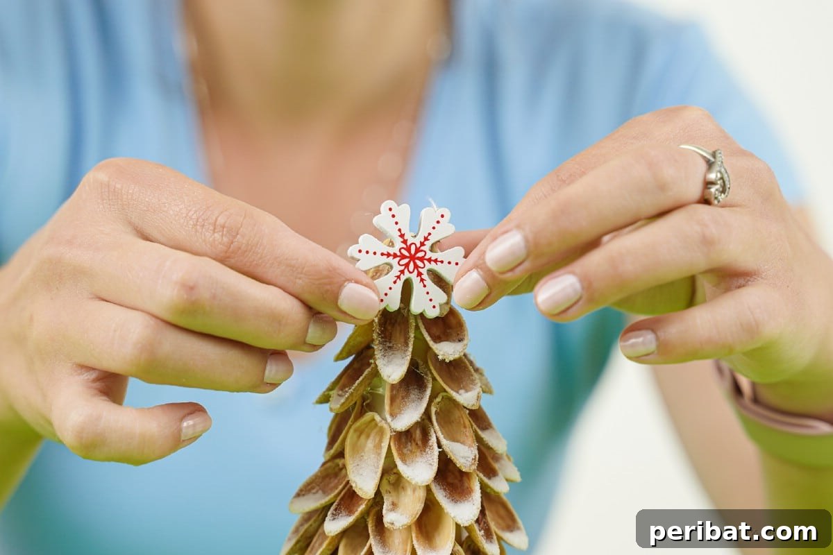 DIY Mini Christmas Trees from Upcycled Pistachio Shells 13 Pistachio shell Christmas tree with a star on top