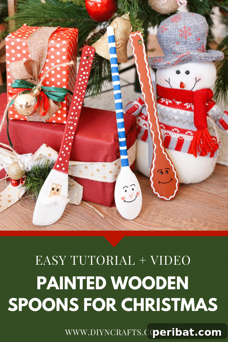 3 Painted wooden spoons under a Christmas tree