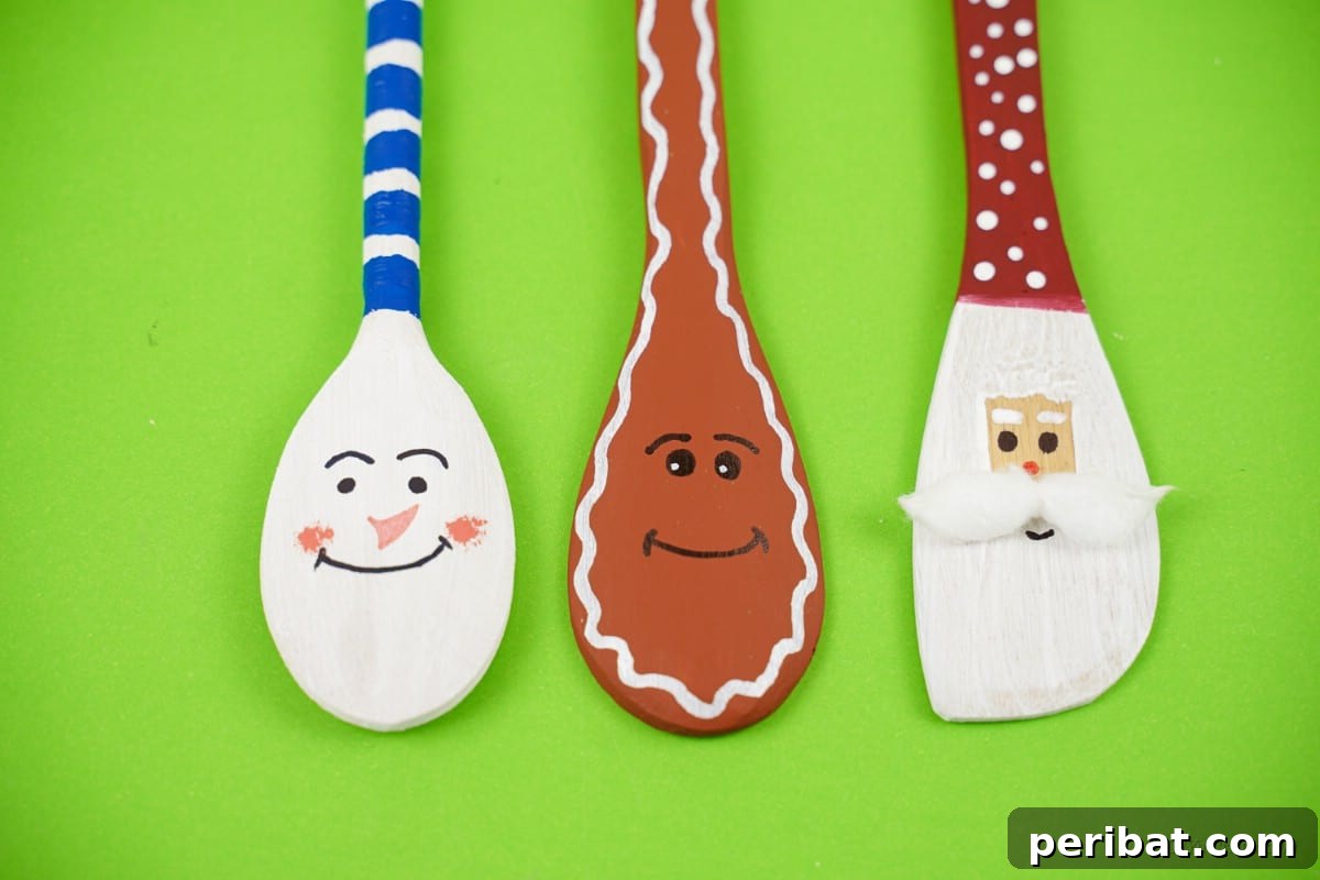 Three wooden spoons with faces Christmas character designs