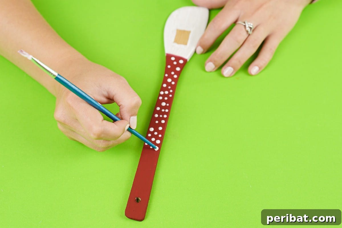 Santa hat polka dots white paint wooden spoon
