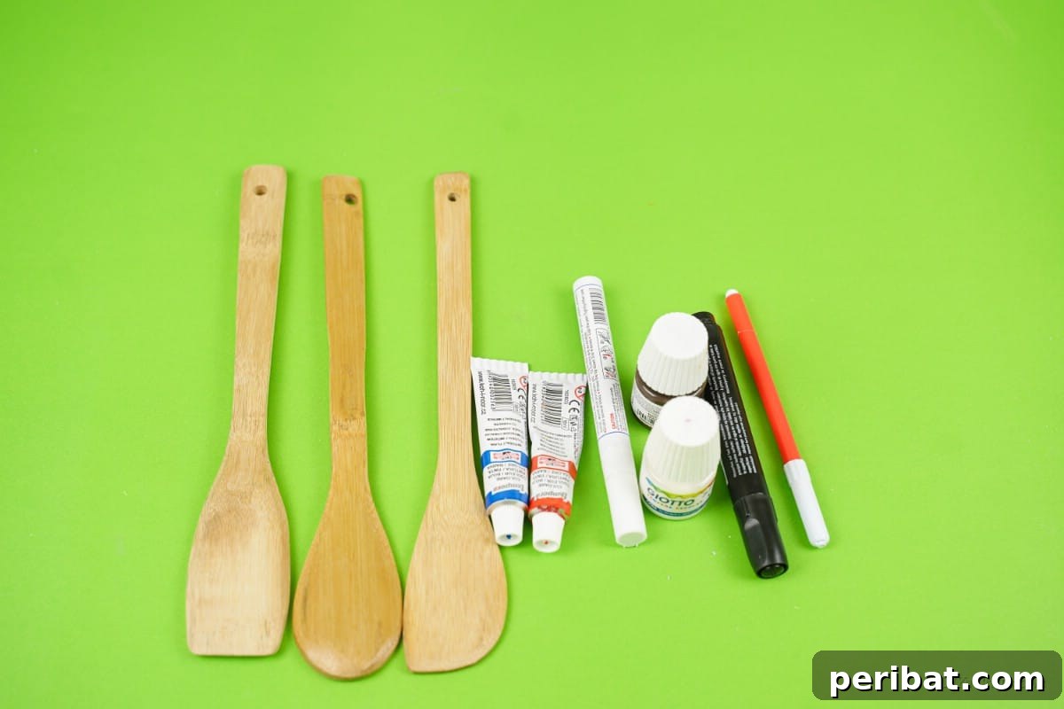 Craft supplies wooden spoons paint markers on table