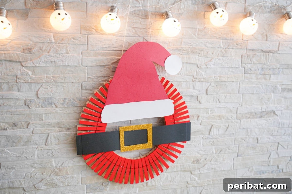 Craft a Delightful Santa Hat Wreath for Christmas 6 Wreath with lights hanging on a wall, showcasing a cozy ambiance.