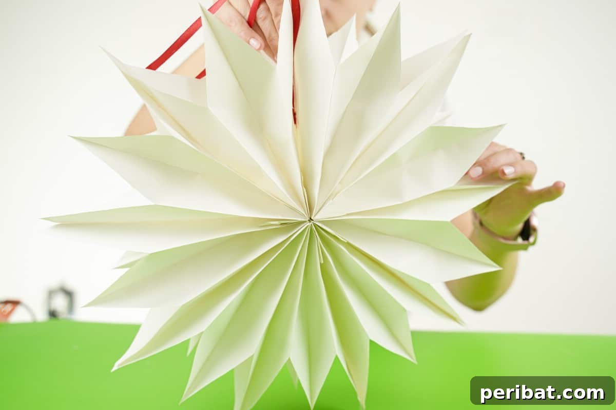 DIY Giant Paper Bag Star Decorations 12 Open paper bag craft star design, fanning out beautifully