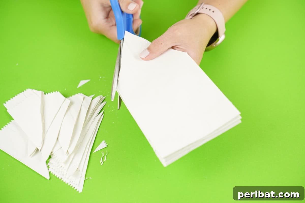 DIY Giant Paper Bag Star Decorations 9 Scissors cutting white paper bag to form star point