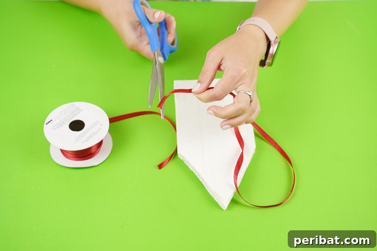 DIY Giant Paper Bag Star Decorations 10 Scissors cutting red ribbon for craft project
