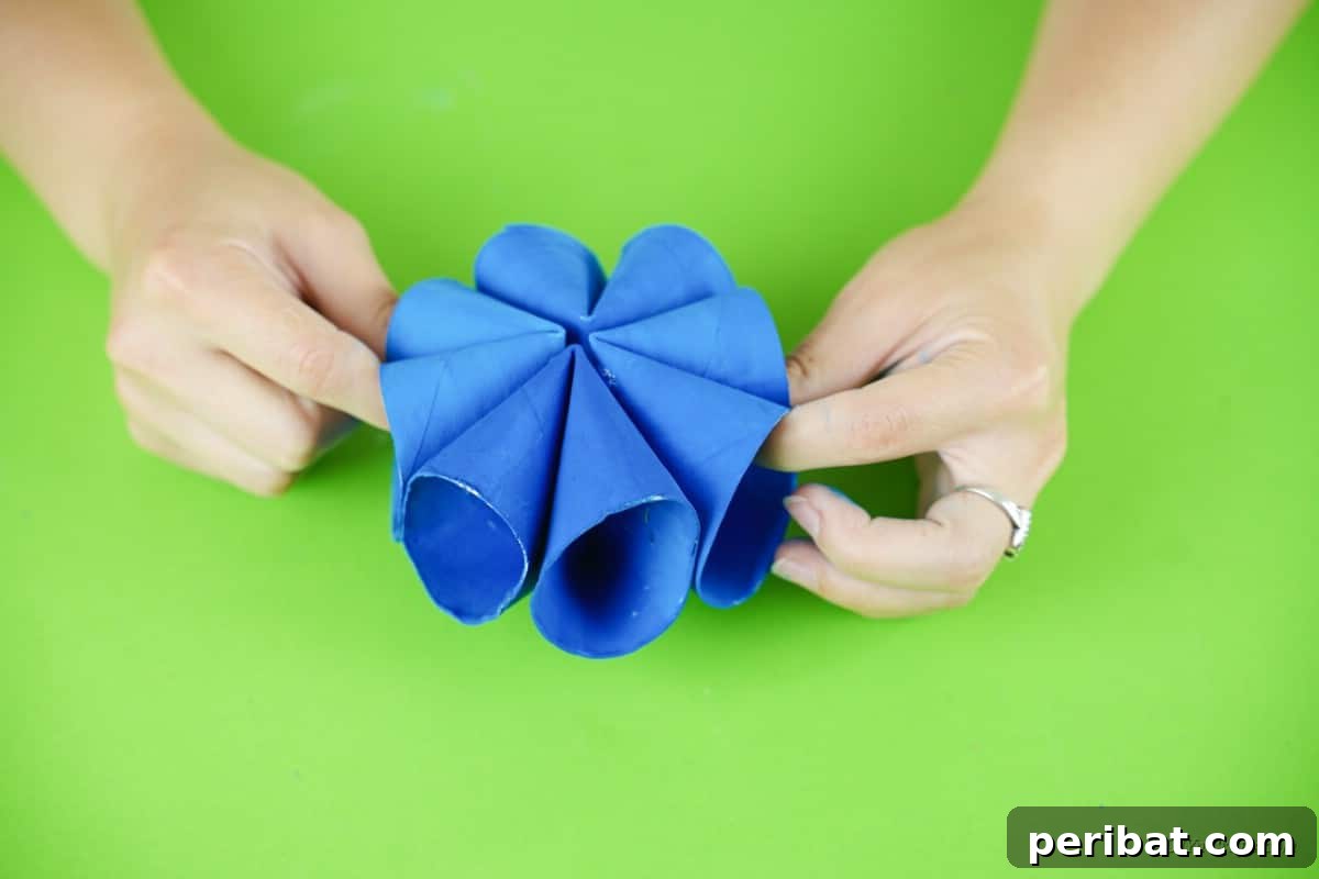 Roll-Upcycled Christmas Cheer 14 assembling blue paper craft