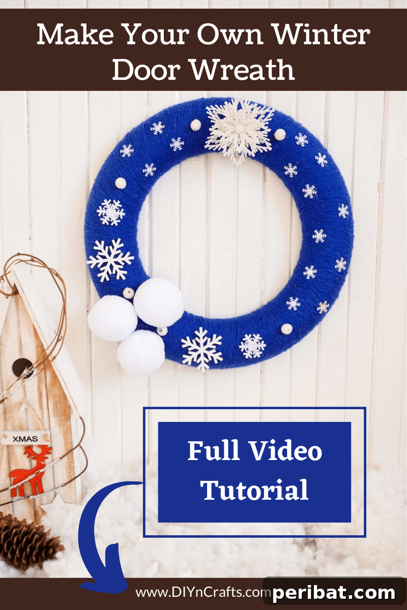 Glistening Snowflake Christmas Wreath 2 Beautiful blue and white snowflake wreath hanging on a textured wall, ready to welcome winter