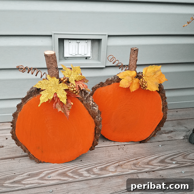 55+ Creative DIY Pumpkin Decorating Ideas for Fall 17 Rustic wood slice pumpkins artfully arranged by a house wall, perfect for natural Fall decor