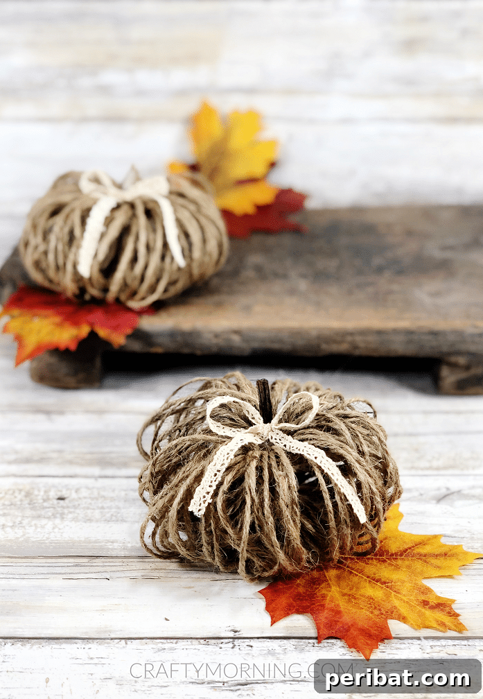 55+ Creative DIY Pumpkin Decorating Ideas for Fall 18 A charming DIY twine pumpkin displayed on a rustic wooden surface for Fall decoration