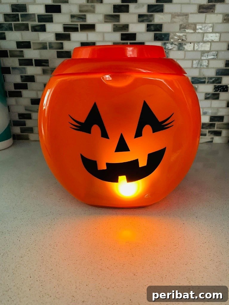 55+ Creative DIY Pumpkin Decorating Ideas for Fall 19 A creative laundry detergent container transformed into a pumpkin, sitting on a kitchen counter
