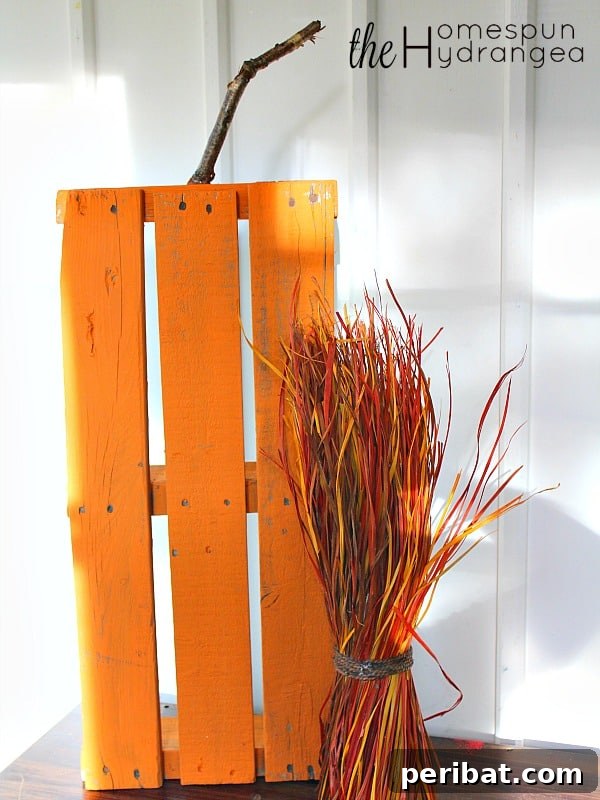 55+ Creative DIY Pumpkin Decorating Ideas for Fall 23 A rustic DIY wood pallet pumpkin craft leaning against a wall, perfect for Fall decor