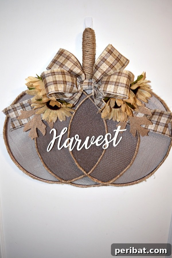 55+ Creative DIY Pumpkin Decorating Ideas for Fall 28 A creative dollar store splatter screen pumpkin decoration with 'Harvest' text on a wall