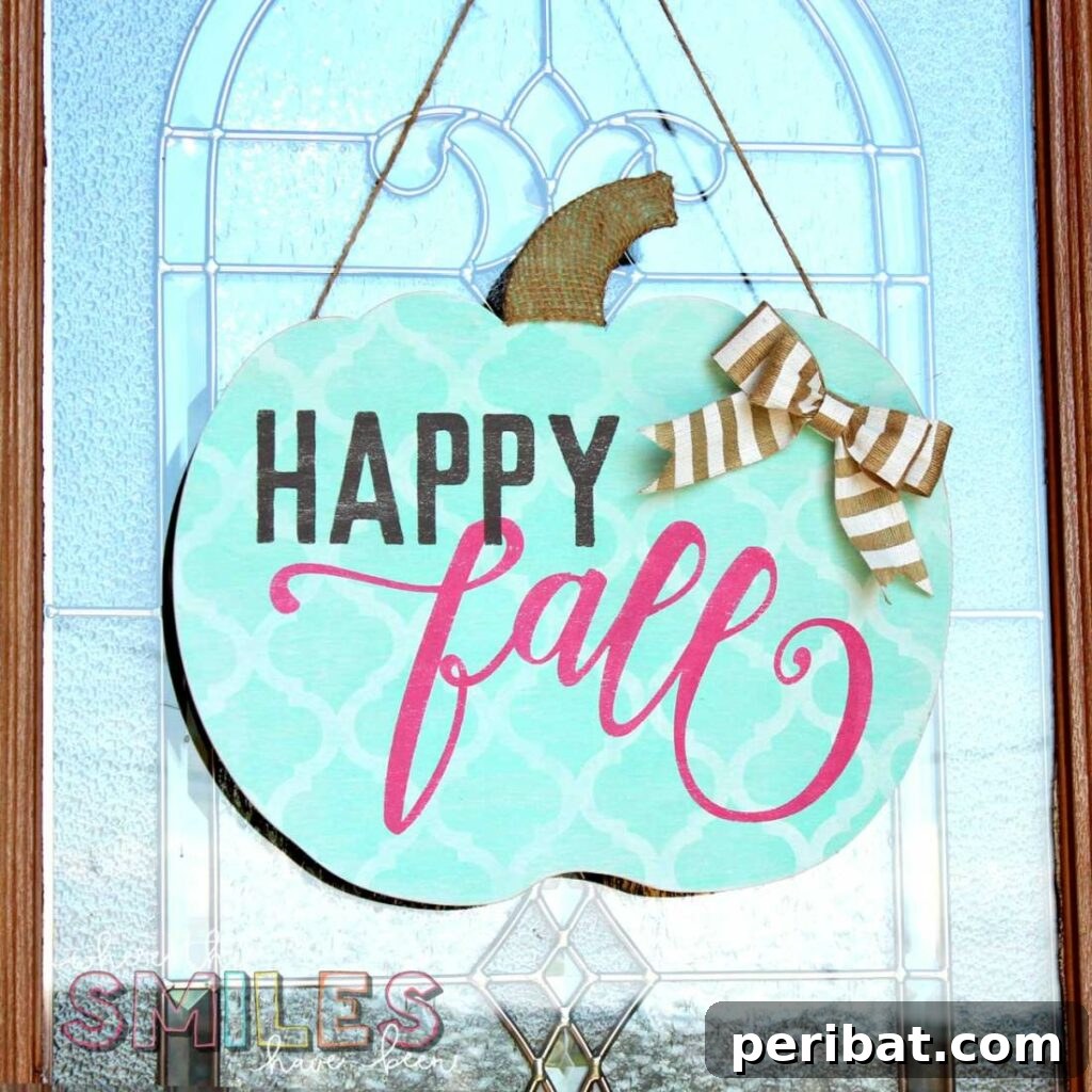 55+ Creative DIY Pumpkin Decorating Ideas for Fall 29 A shabby chic teal pumpkin door hanger with 'Happy Fall' text, adorning a door with a window