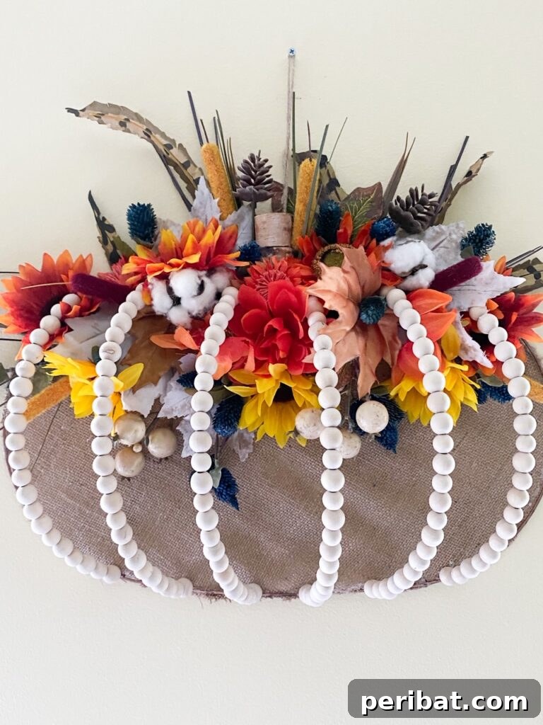 55+ Creative DIY Pumpkin Decorating Ideas for Fall 31 A unique 3D hanging bead pumpkin door hanger, crafted with a farmhouse aesthetic