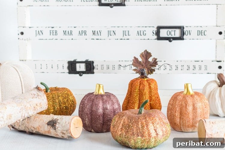 55+ Creative DIY Pumpkin Decorating Ideas for Fall 38 Sparkling DIY glitter pumpkins displayed in front of a calendar, adding upscale shimmer