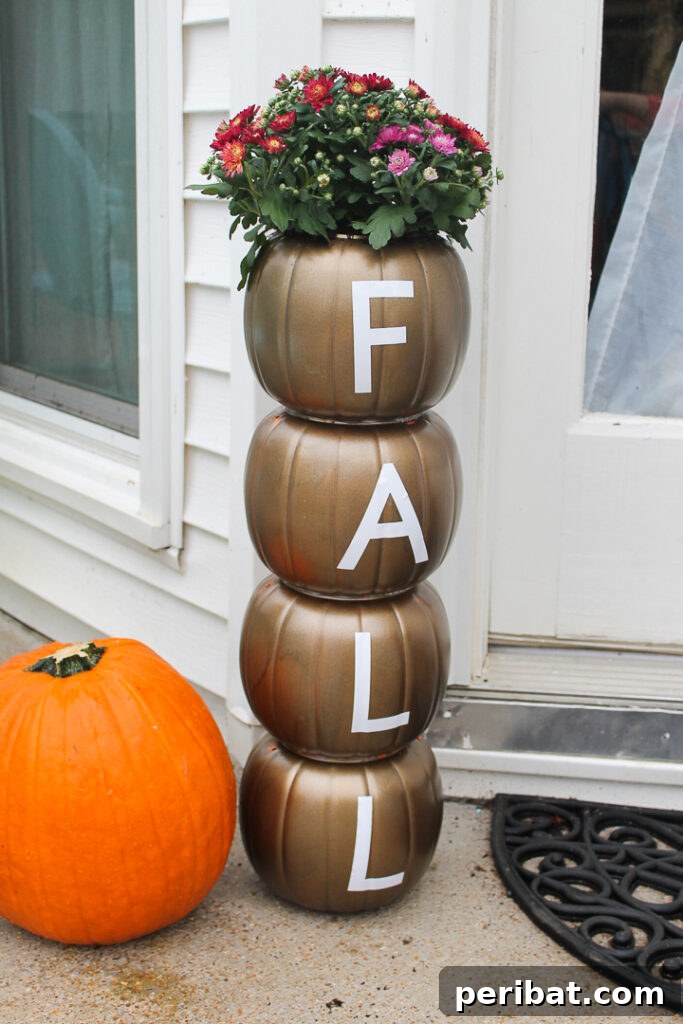 55+ Creative DIY Pumpkin Decorating Ideas for Fall 52 A festive plastic pumpkin stack planter adorned with Fall wording, perfect for an entryway