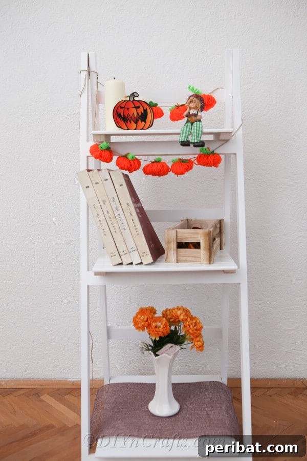 55+ Creative DIY Pumpkin Decorating Ideas for Fall 10 Adorable yarn pumpkin garland, perfect for adding rustic charm to Fall decor