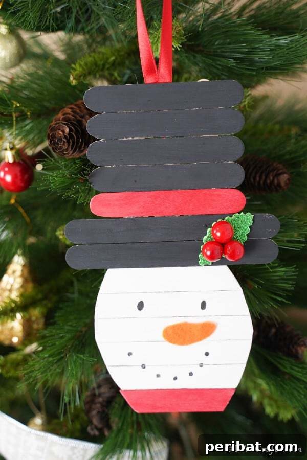Sixty Sparkling DIY Ornaments for Your Christmas Tree 17 Craft stick santa in tree