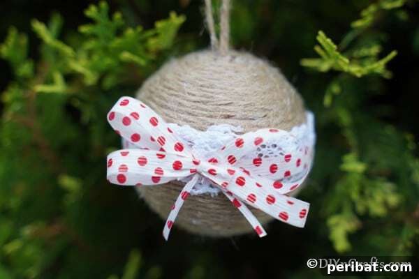 Sixty Sparkling DIY Ornaments for Your Christmas Tree 29 Twine ornament in tree