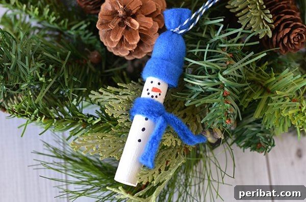 Sixty Sparkling DIY Ornaments for Your Christmas Tree 34 Wood snowman in tree