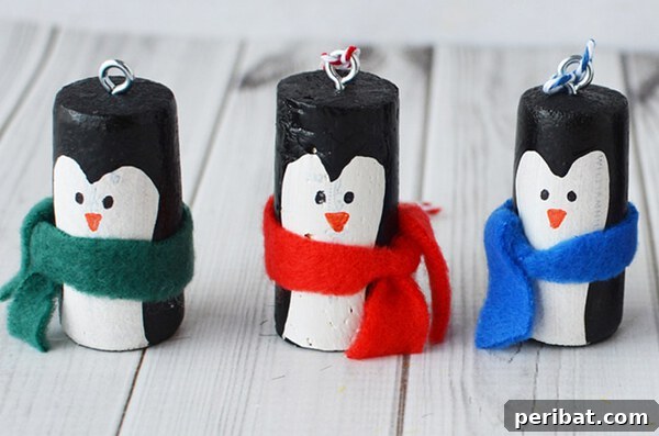 Sixty Sparkling DIY Ornaments for Your Christmas Tree 36 Cork pengiuns in row on table