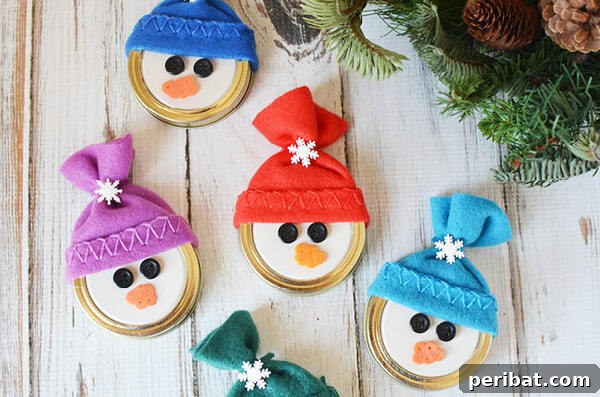 Sixty Sparkling DIY Ornaments for Your Christmas Tree 39 Snowman ornaments on table