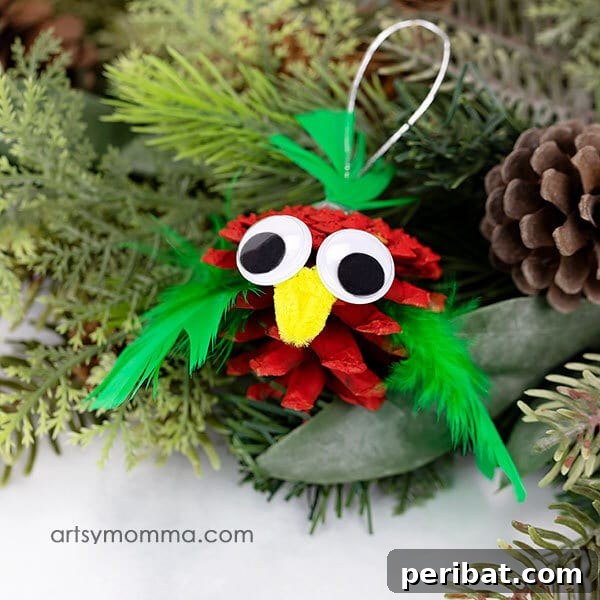 Sixty Sparkling DIY Ornaments for Your Christmas Tree 42 Pine cone bird on tree