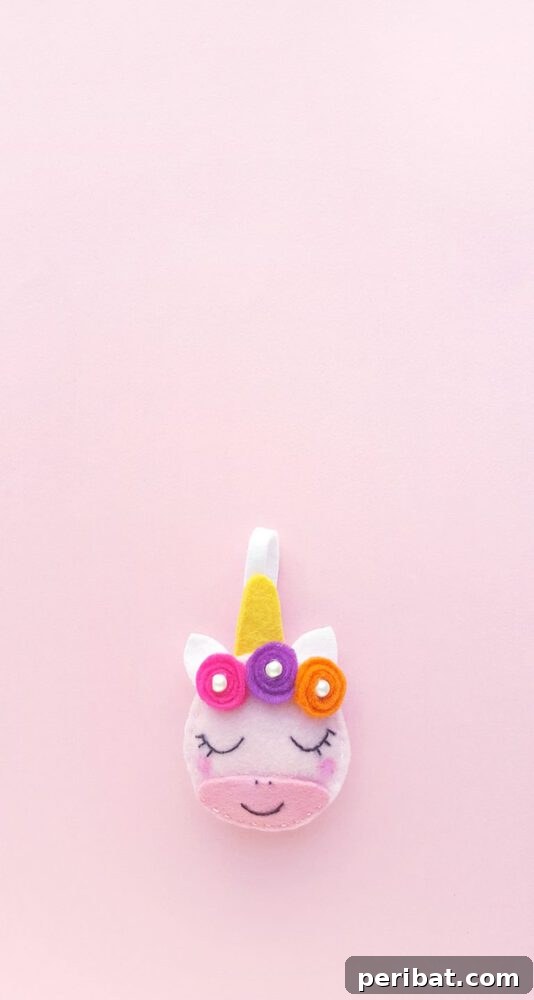 Sixty Sparkling DIY Ornaments for Your Christmas Tree 47 Unicorn ornament on pink surface