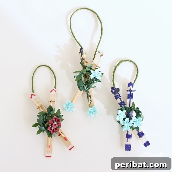 Sixty Sparkling DIY Ornaments for Your Christmas Tree 52 Craft stick ski ornaments on white table