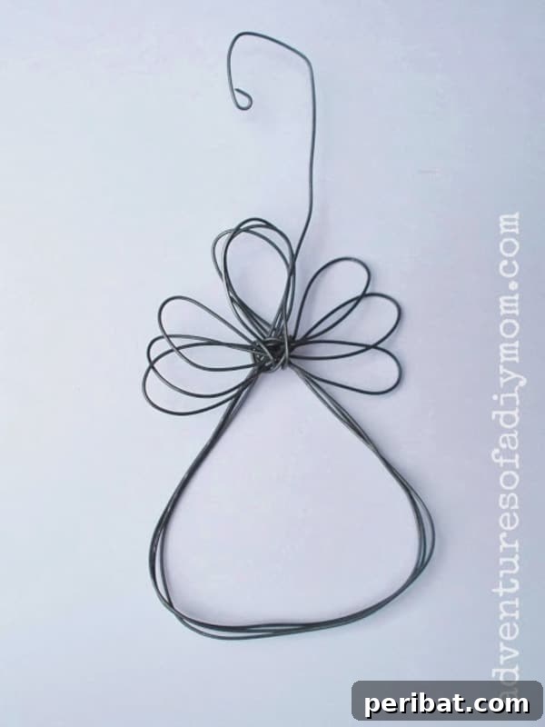 Sixty Sparkling DIY Ornaments for Your Christmas Tree 55 Wire angel on white surface