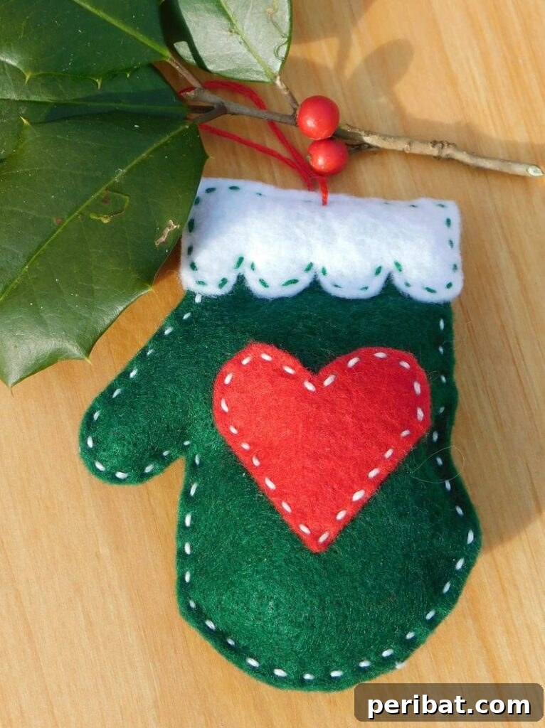 Sixty Sparkling DIY Ornaments for Your Christmas Tree 65 Green felt mitten ornament on wood