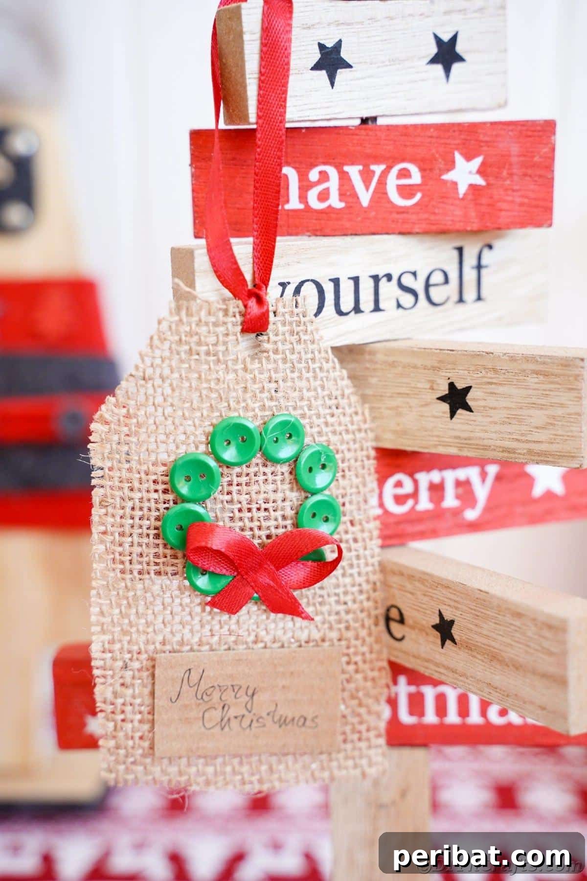 Charming Burlap Christmas Gift Tags: 3 Effortless DIY Styles 4 A charming wreath-themed burlap gift tag, delicately hanging from a holiday sign, showcasing rustic festive decor.