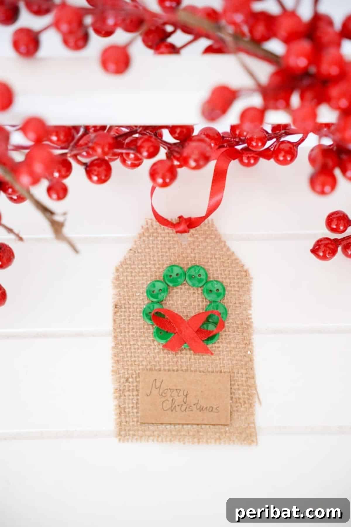 Charming Burlap Christmas Gift Tags: 3 Effortless DIY Styles 5 A burlap gift tag adorned with some festive holiday cherries, lying on a wooden surface.
