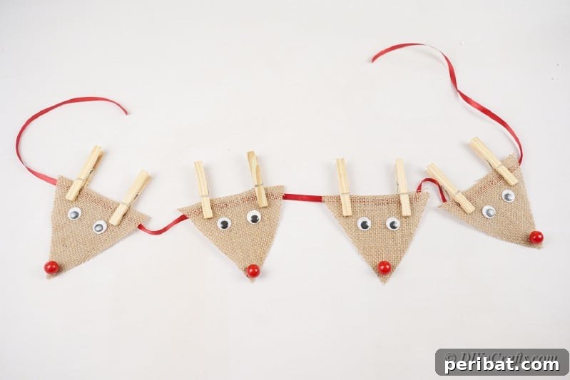 Rustic Reindeer Burlap Garland 17 Burlap reindeer arranged on a piece of ribbon