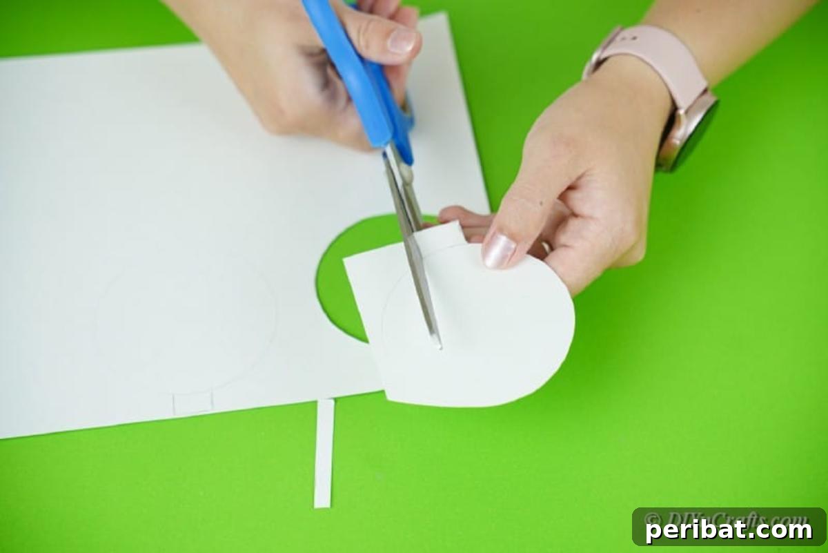 Cutting out paper shapes to be used as ornaments