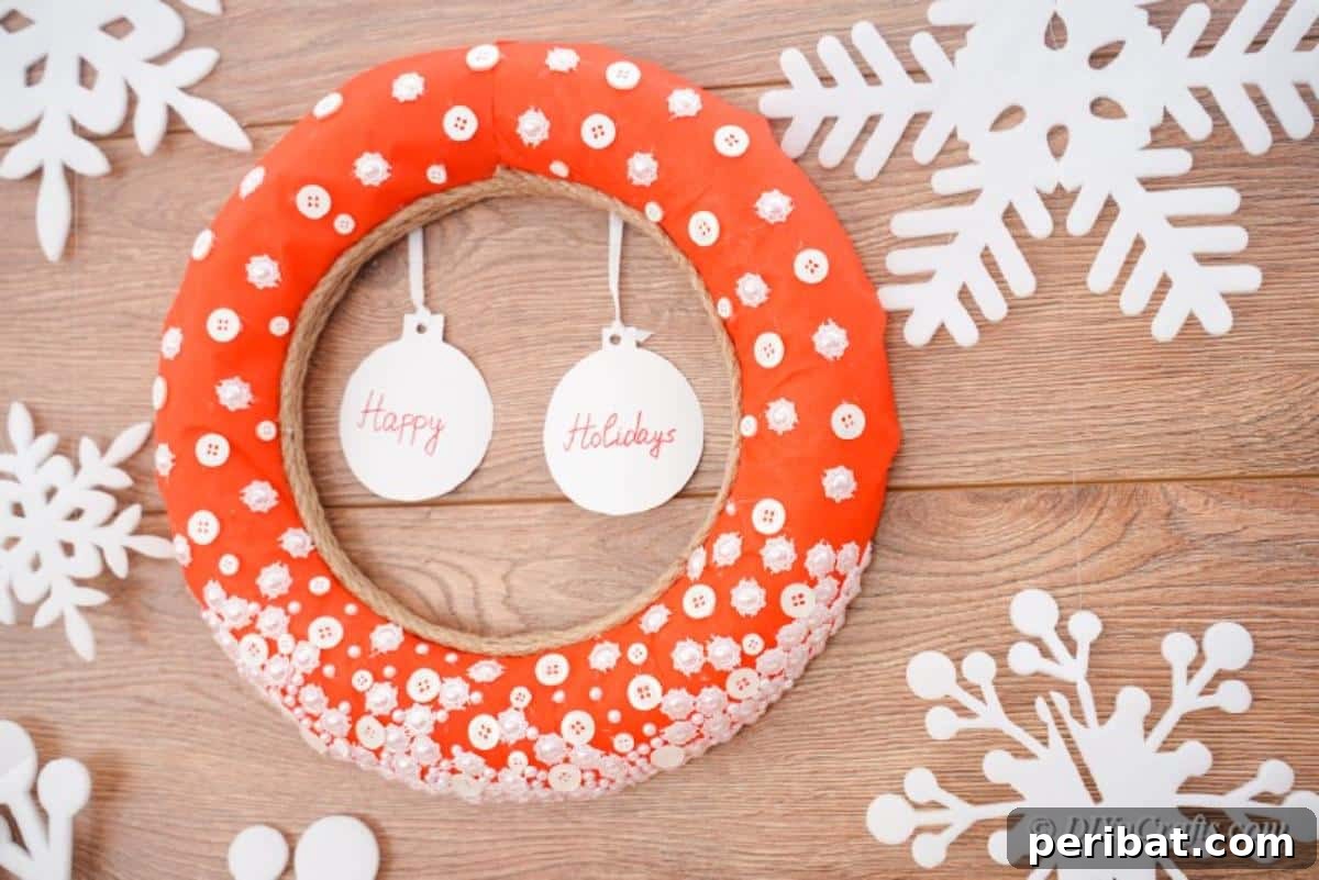 Close-up of a decorative holiday wreath made from white buttons