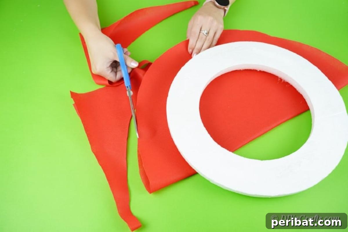 Arranging cut wrapping paper on a foam floral ring