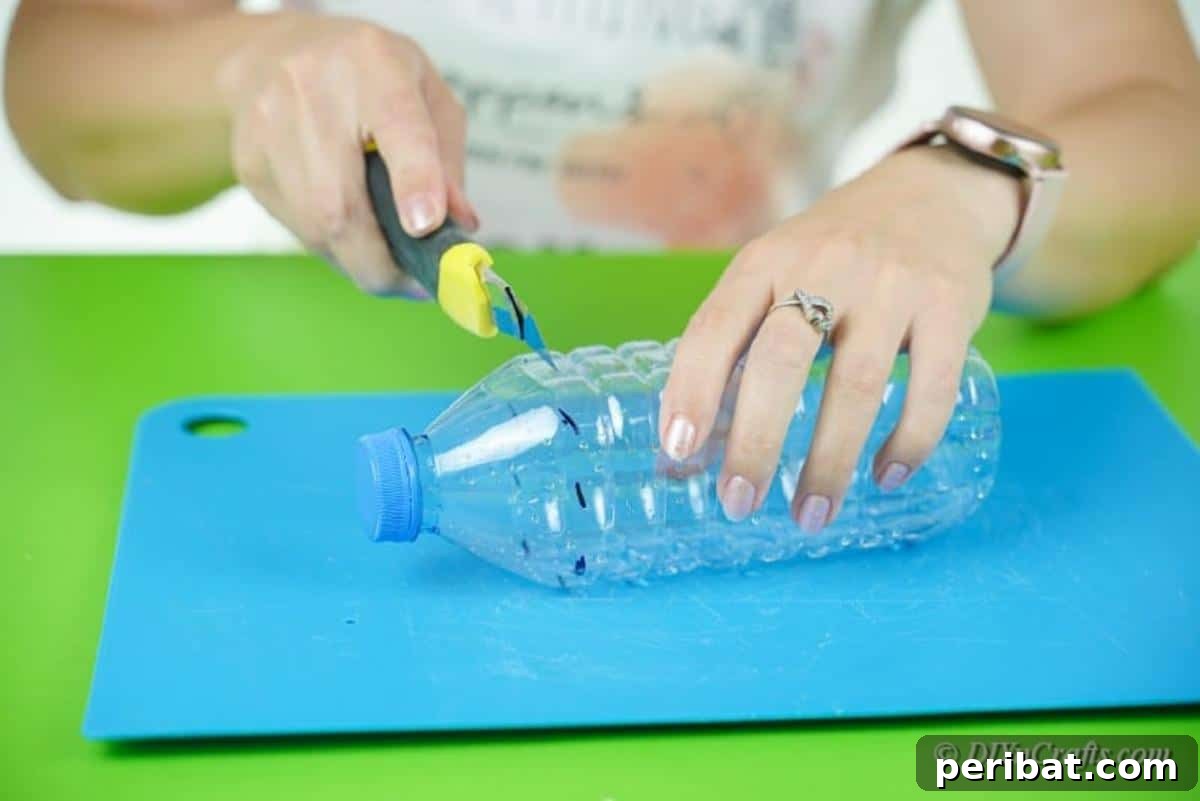 Upcycled Plastic Bottle Santa Boot Decor 11 Hands cutting a plastic water bottle along its tapered top section