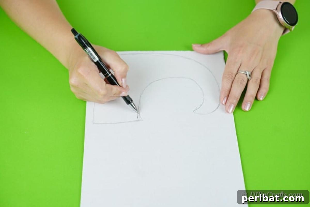 Upcycled Plastic Bottle Santa Boot Decor 7 Woman tracing a boot shape onto craft paper with a pencil