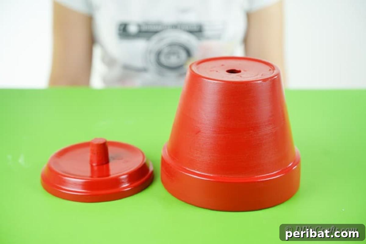 Festive Candy Dispenser on a Budget 11 red painted clay flower pot
