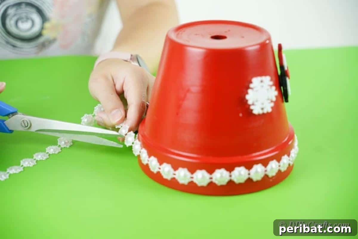 Festive Candy Dispenser on a Budget 13 snowflakes being applied to pot