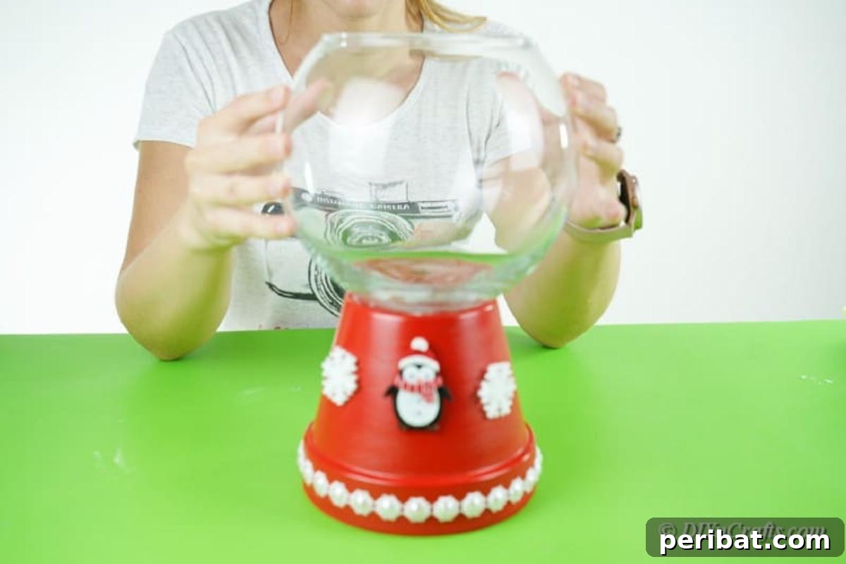 Festive Candy Dispenser on a Budget 14 glass bowl on top of clay pot