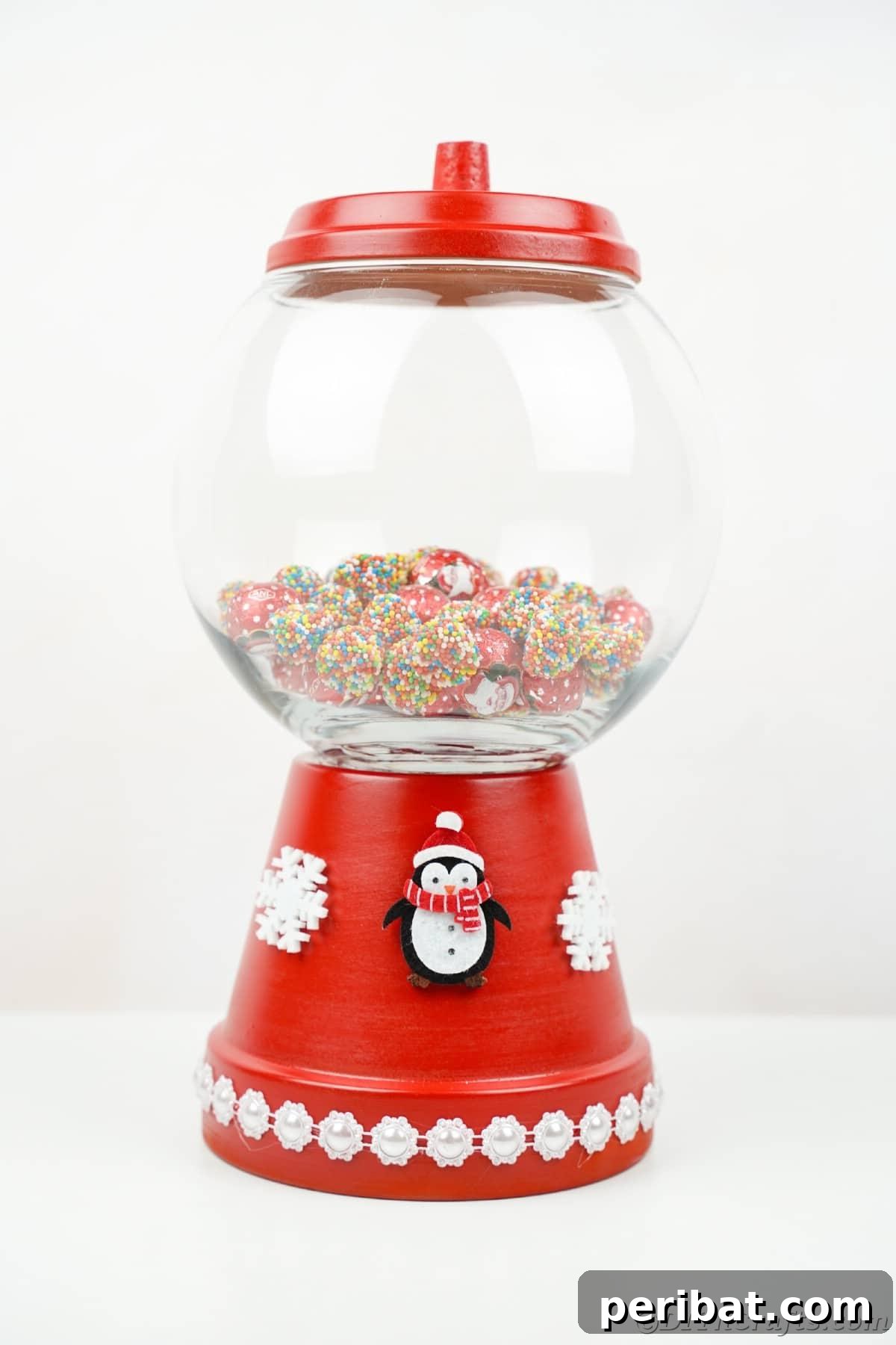 Festive Candy Dispenser on a Budget 16 flower pot candy jar with penguin on base on white table